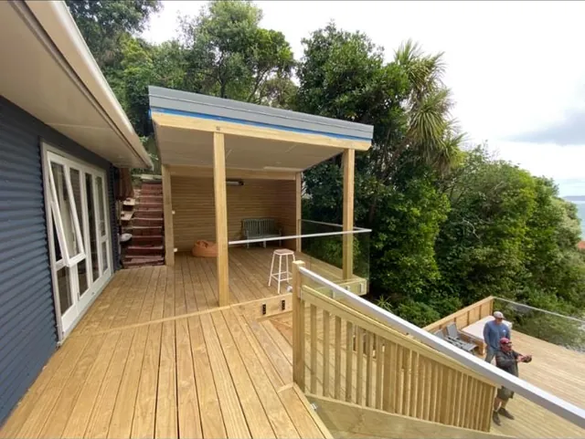 Timber deck with a covered outdoor room, stairs and glass balustrade